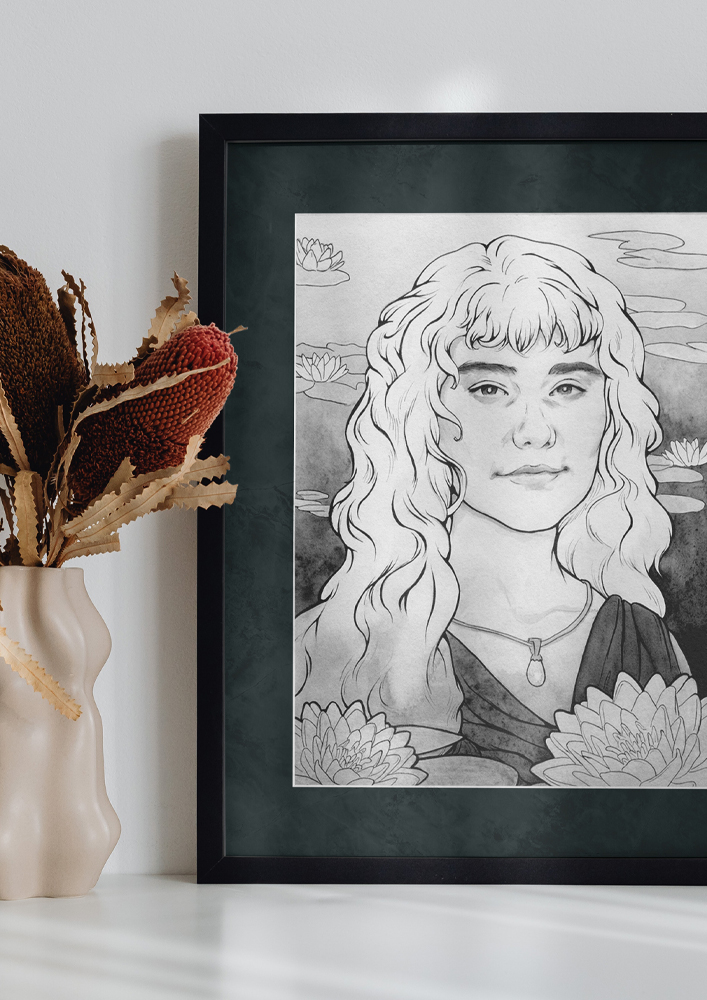 Framed original painting inspired by Goldberry from “The Lord of the Rings” by J.R.R. Tolkien. Ink portrait of a fair-haired woman surrounded by water lilies. Next to the painting, there is a vase with plants.